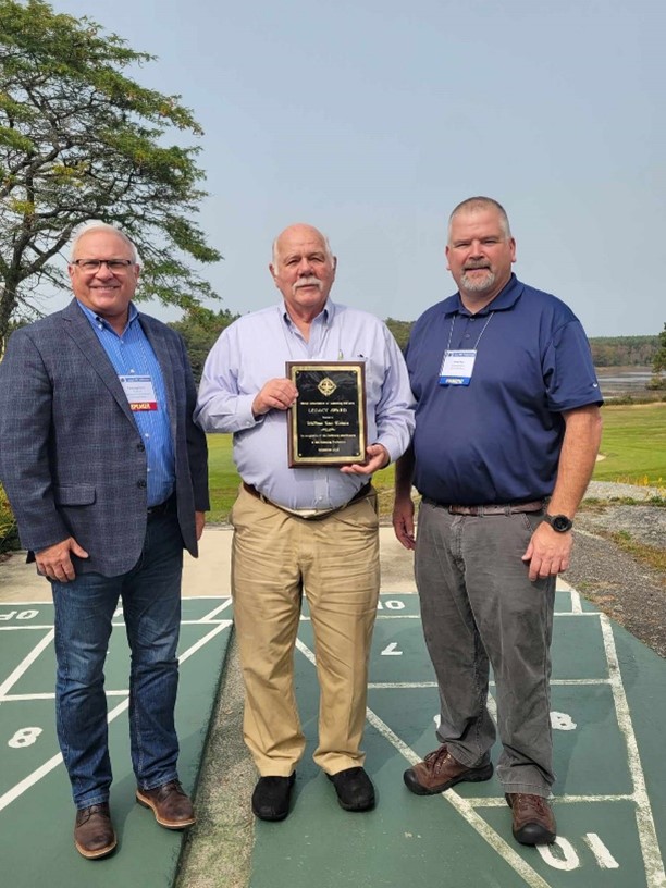 (In this picture is IAAO President Pat Alesandrini, Bill Van Tuinen and MAAO President Travis Roy)